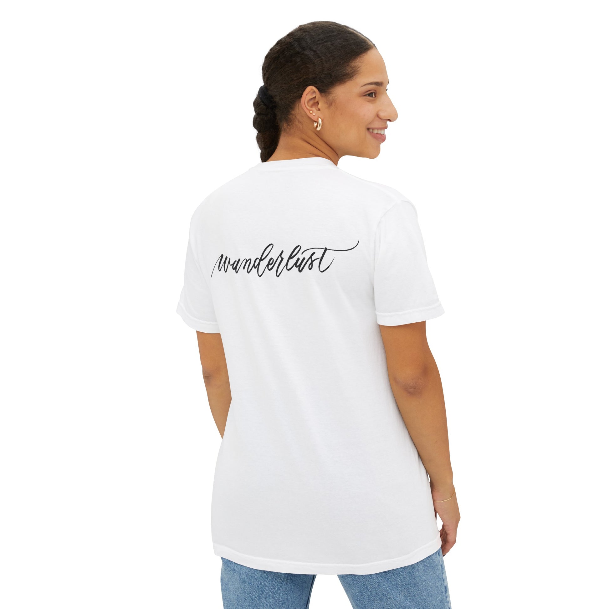 Woman turning to the side wearing a wanderlust t-shirt, perfect for traveling and airplane flights.