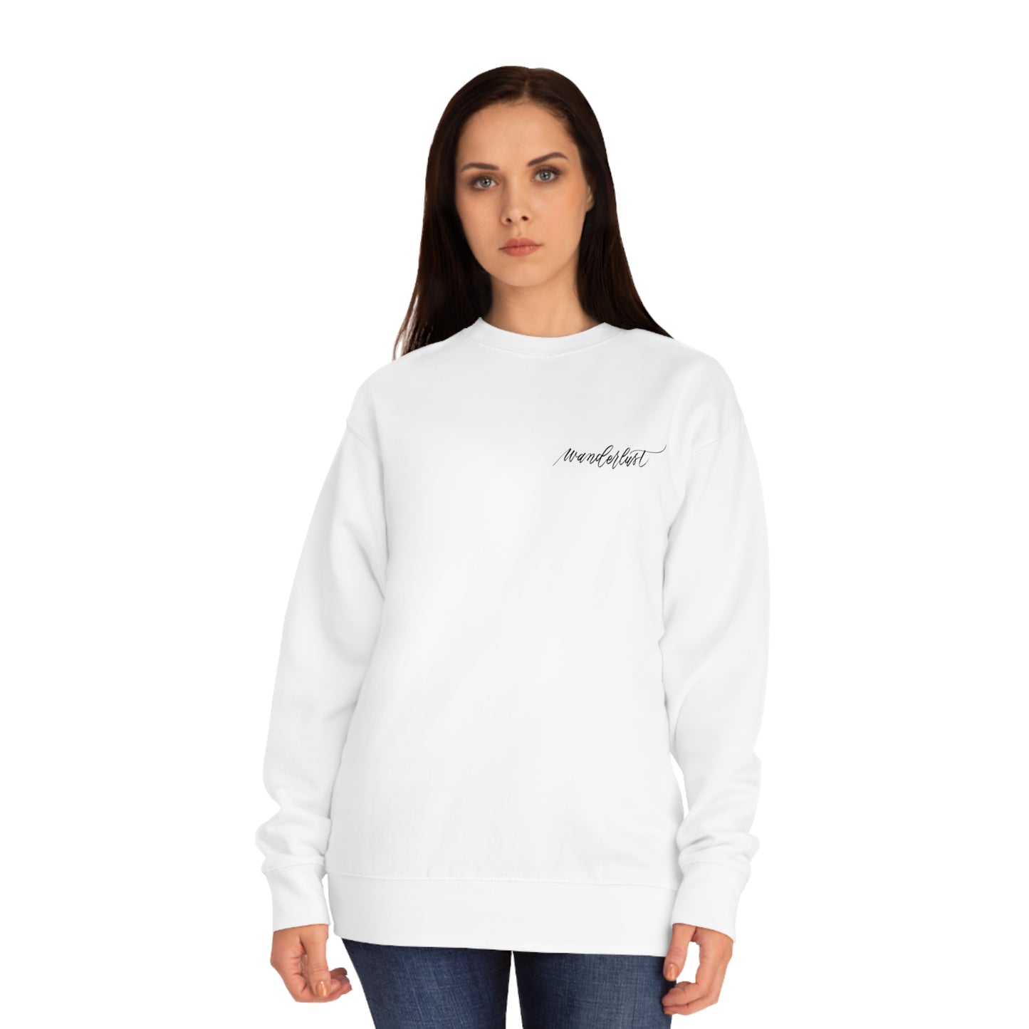 Woman wearing white crew neck sweatshirt with modern calligraphy word "wanderlust" on left chest.