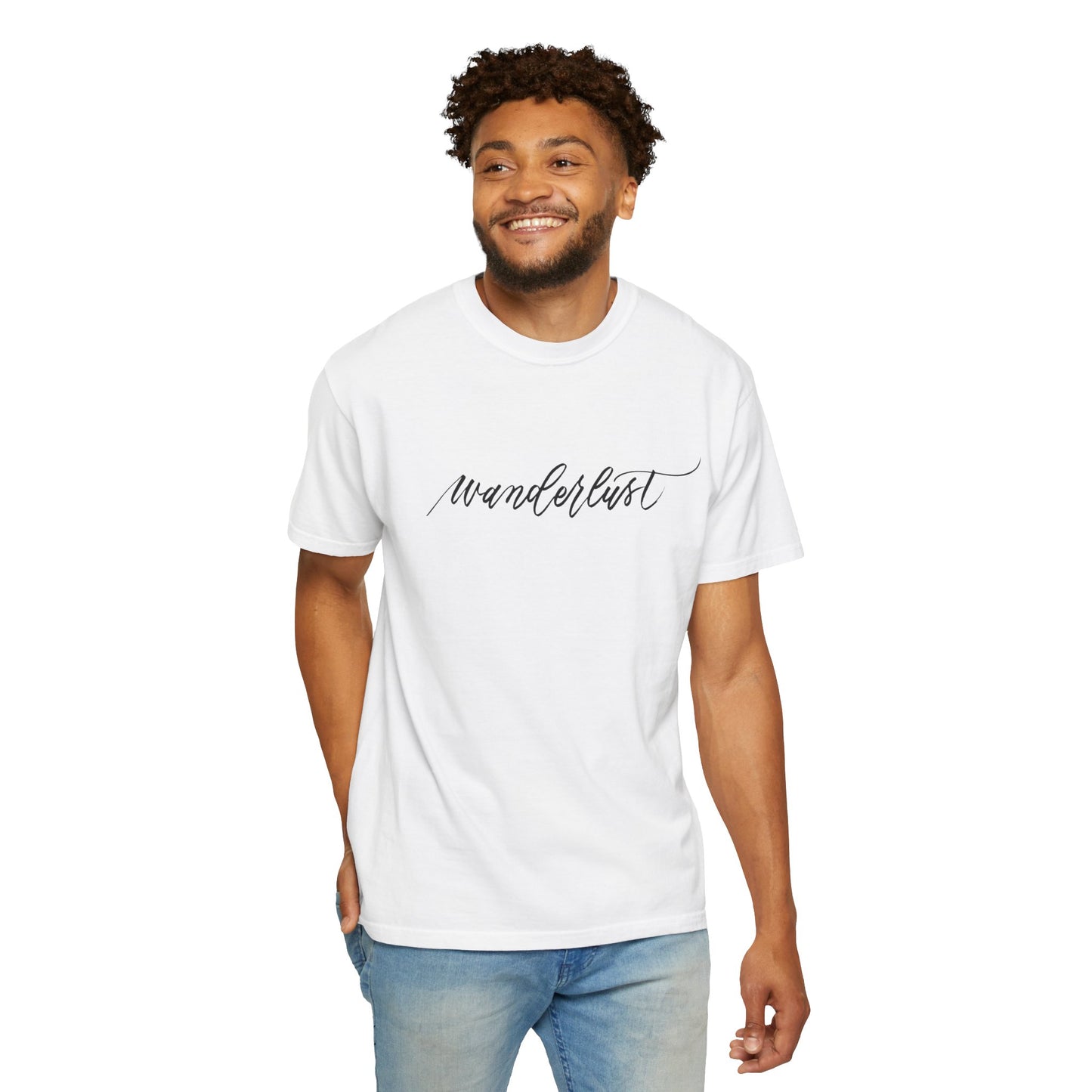 Smiling man wearing white t-shirt front view reads "wanderlust" handwritten in beautiful calligraphy.