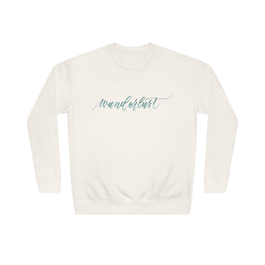 Ivory crew neck sweatshirt with modern brush calligraphy word "wanderlust" across the front of the shirt.