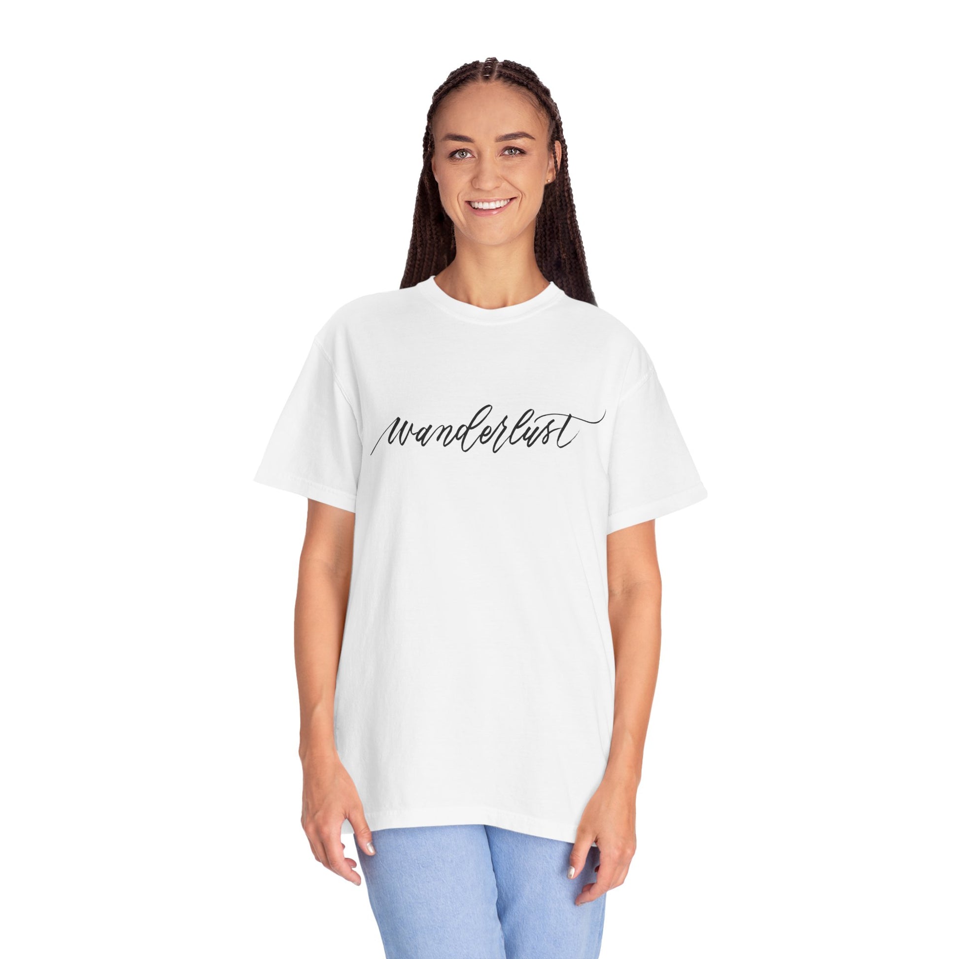 Woman wearing white t-shirt front view reads "wanderlust" handwritten in beautiful calligraphy that says "wanderlust".