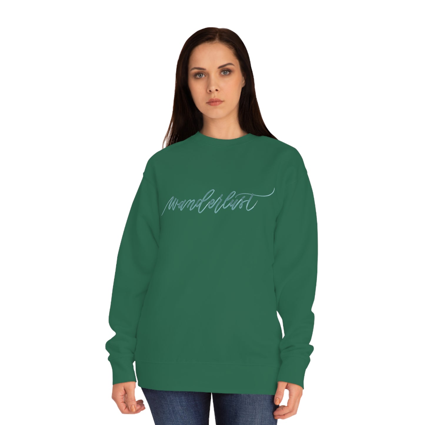 Woman wearing green crewneck sweatshirt with a calligraphy design on front that reads "wanderlust".