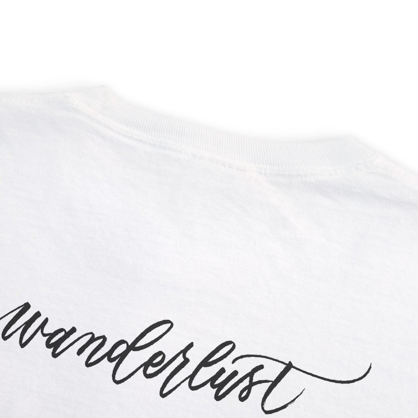 Wanderlust script on back of t-shirt flat lay.